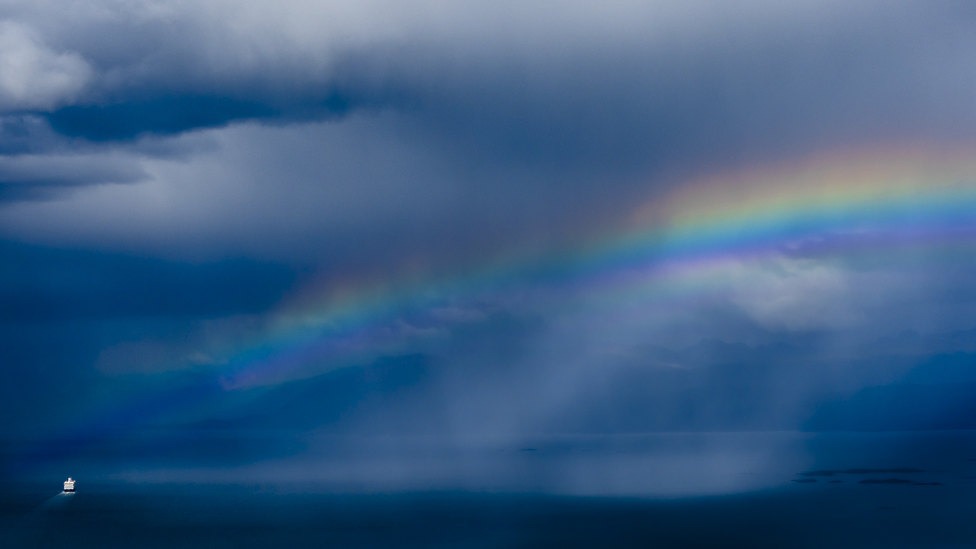 A ship sails into a moody Drake Passage. One of the roughest stretches of ocean in the world.