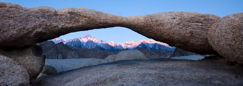 The Sierra Nevada Range viewed from Lathe Arch in the Alabama Hills