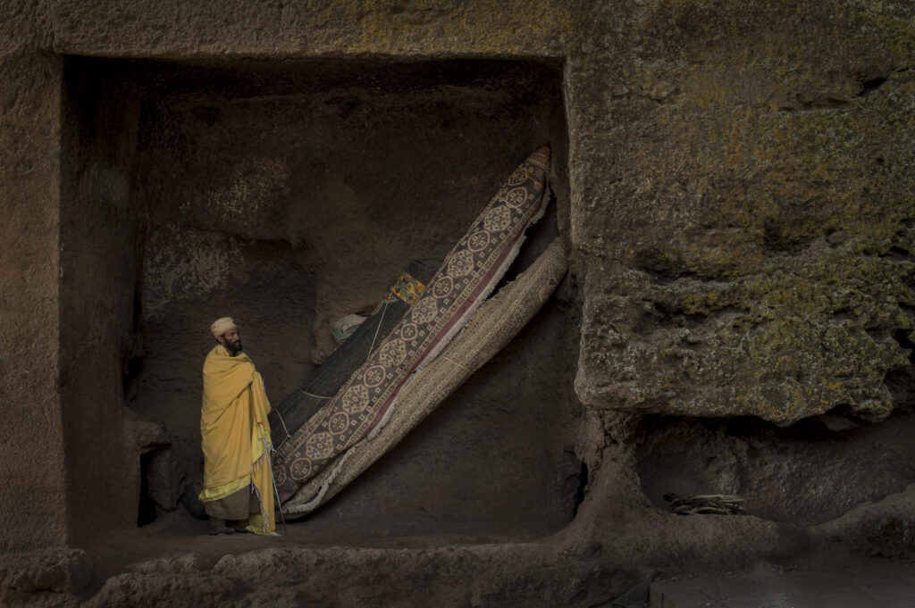 Monk praying in Lalibela