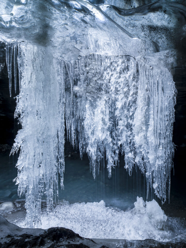 As Iceland'a glaciers melt they form ice caves - wonderlands of shape and color.