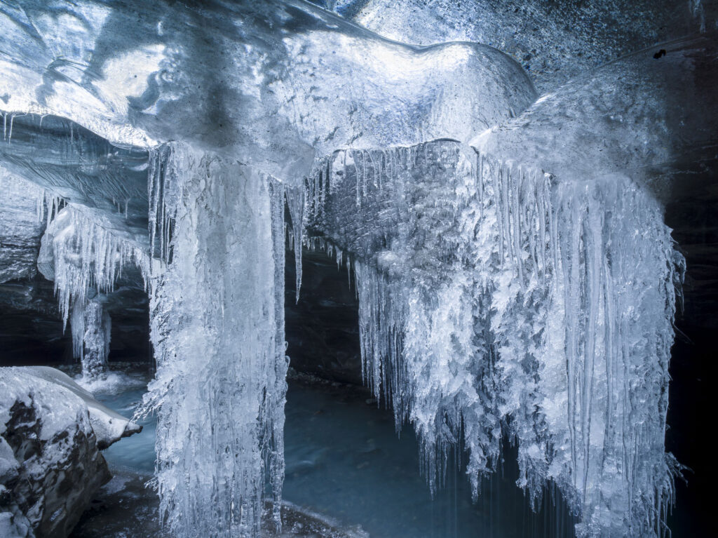 As Iceland'a glaciers melt they form ice caves - wonderlands of shape and color.