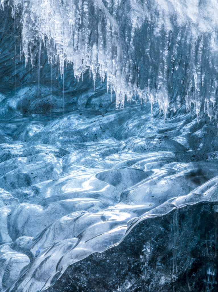 As Iceland'a glaciers melt they form ice caves - wonderlands of shape and color.