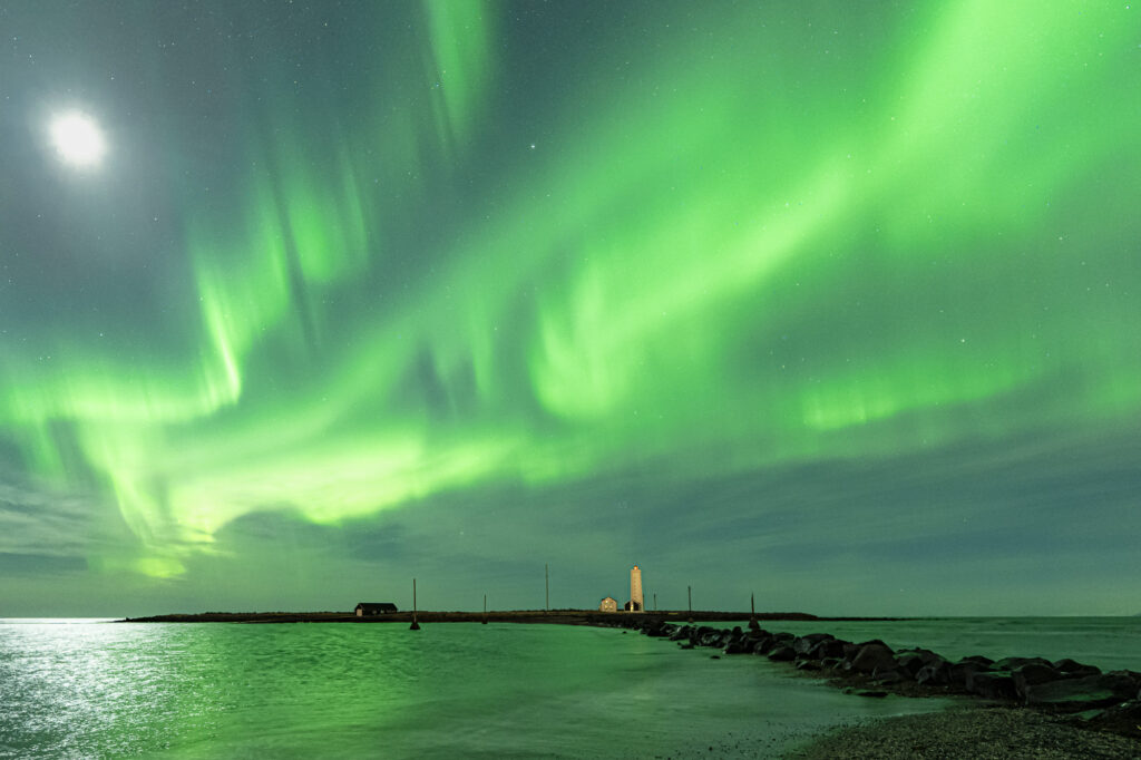 An aurora lights the night sky in Iceland.