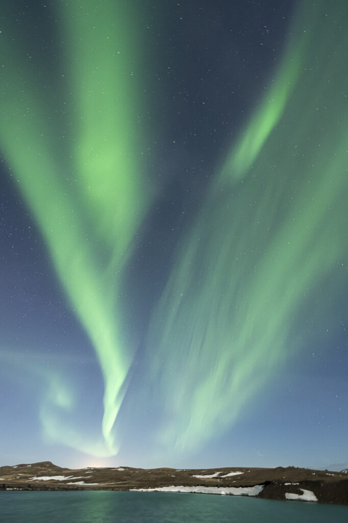 An aurora lights the night sky in southern Iceland.