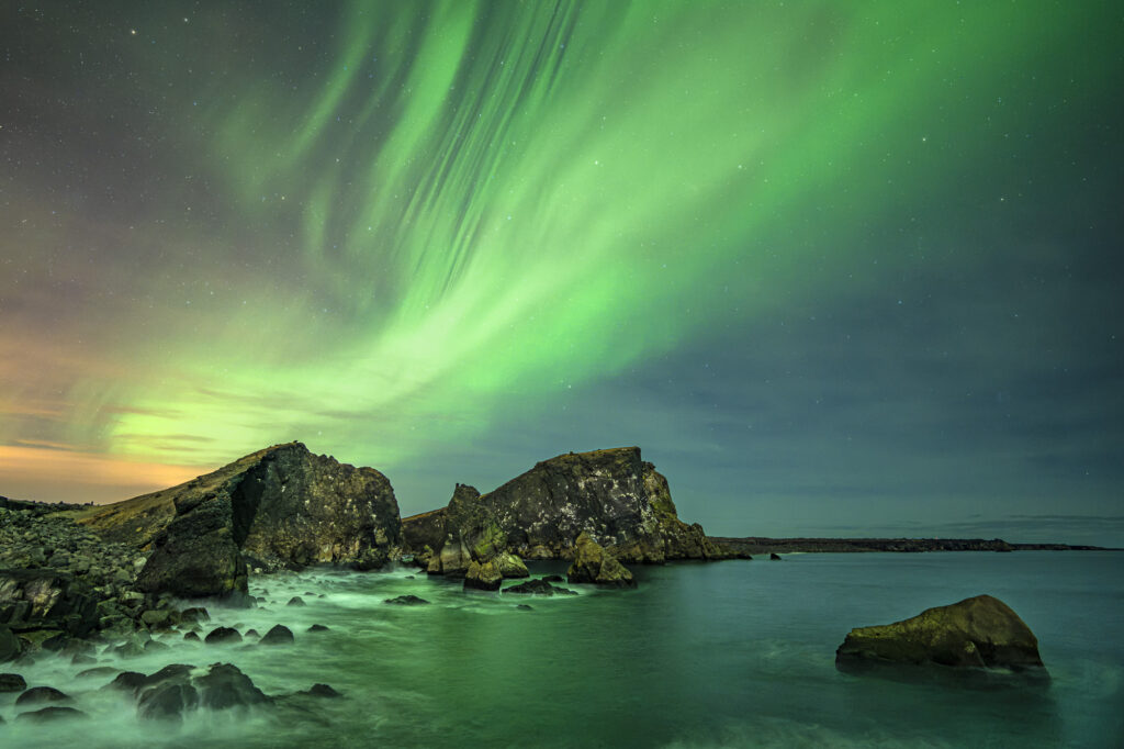 An aurora lights the night sky in southern Iceland.