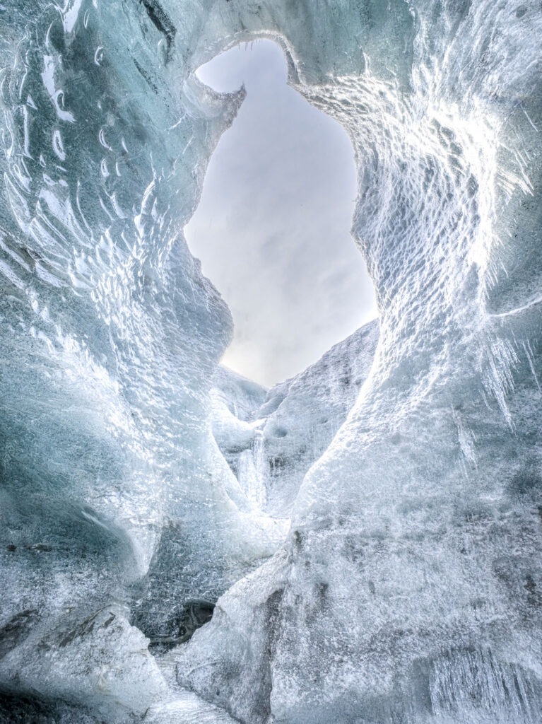 As Iceland'a glaciers melt they form ice caves - wonderlands of shape and color.