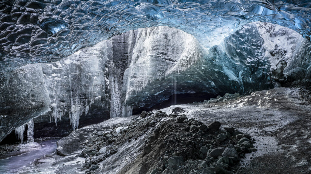 As Iceland'a glaciers melt they form ice caves - wonderlands of shape and color.