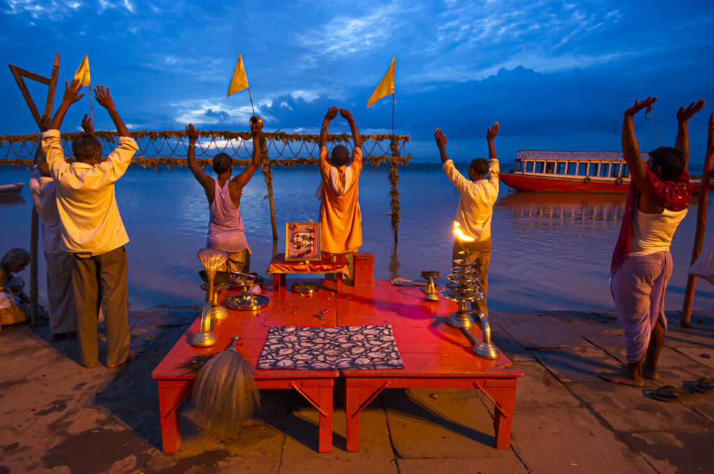Morning puja (prayers) next to the Ganges River in Varanasi.