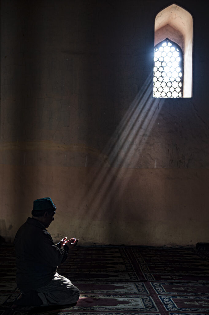A Muslim man prays in a mosque in Srinagar.