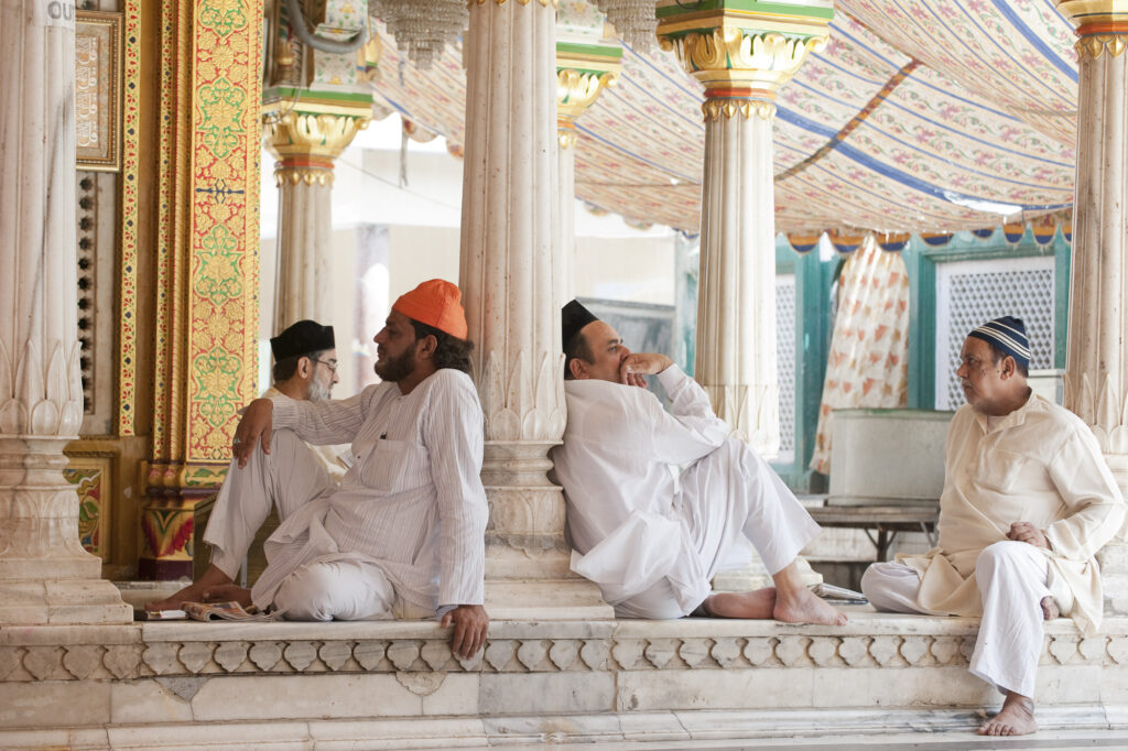Muslim men while away the afternoon at Nizamuddin Shrine in New Delhi.