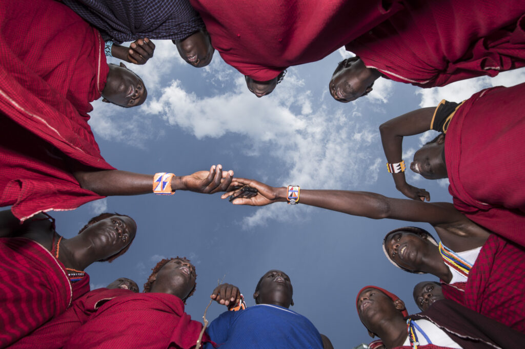 Maasai warriors (known as moran) gather in a circle to sing.