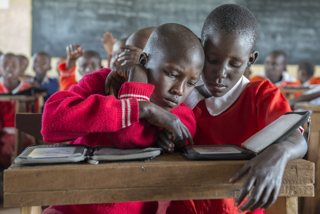 Today Maasai students learn tro read using e-readers instead of traditional books.