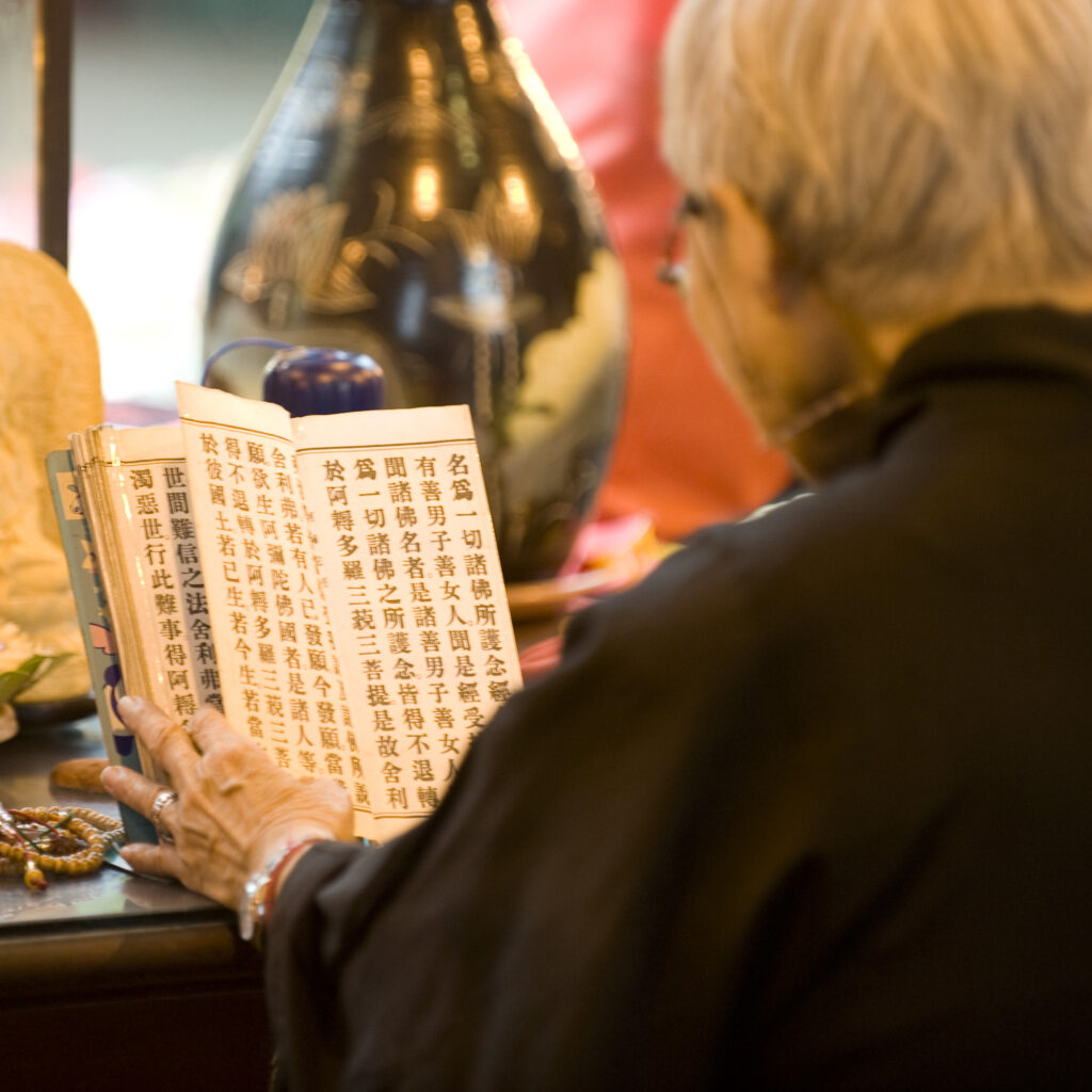 A monk prays at Longshan Temple, Taipei, Taiwan