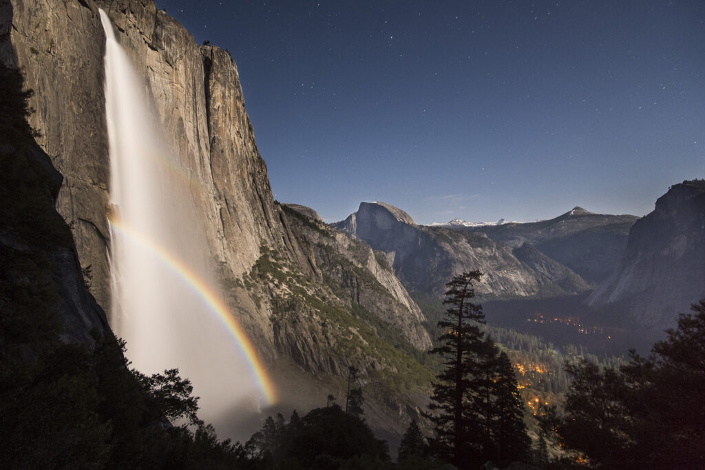 A double moon bow in the mists of Yosemite Falls at night.
