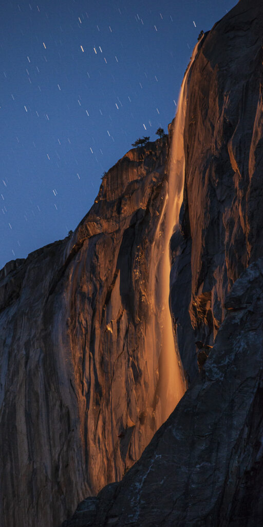 Yosemite's "fire fall" lit by the last rays of the setting moon