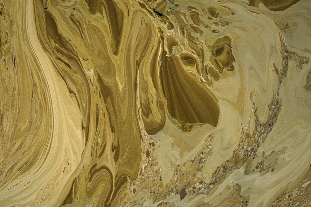 Algae interacts with the alkaline soda in Lake Magadi to create incredible patterns.