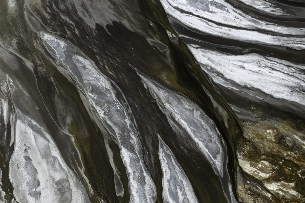Algae interacts with the alkaline soda in Lake Magadi to create incredible patterns.
