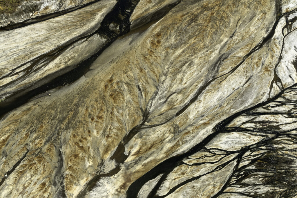 Algae interacts with the alkaline soda in Lake Magadi to create incredible patterns.