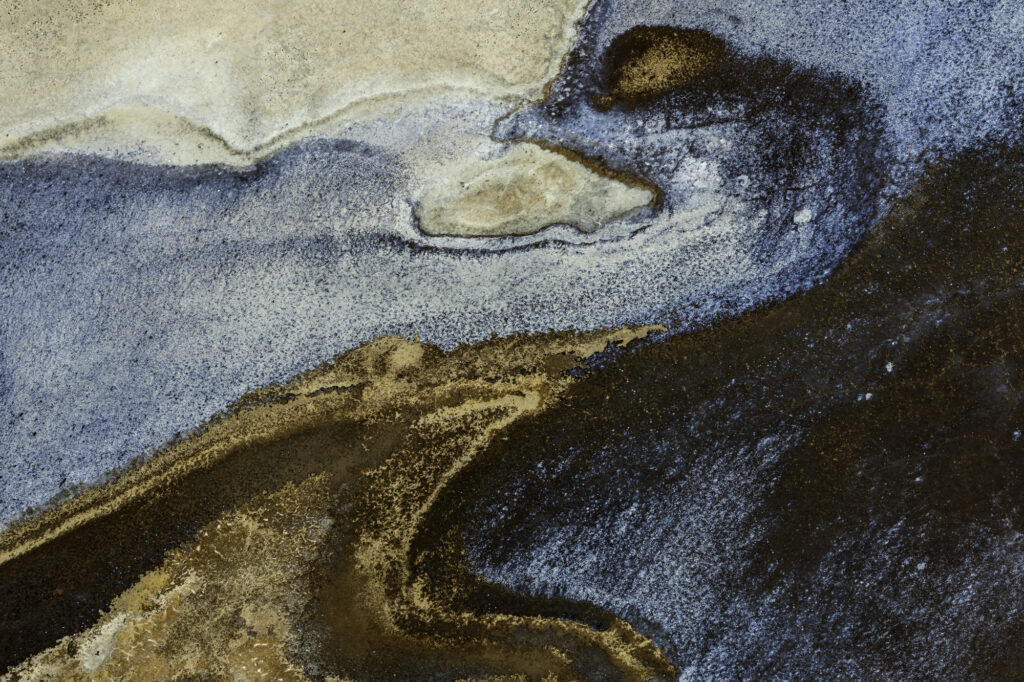 Algae interacts with the alkaline soda in Lake Magadi to create incredible patterns.