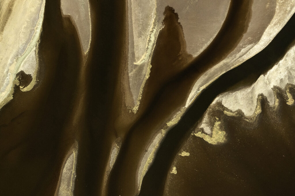 Algae interacts with the alkaline soda in Lake Magadi to create incredible patterns.